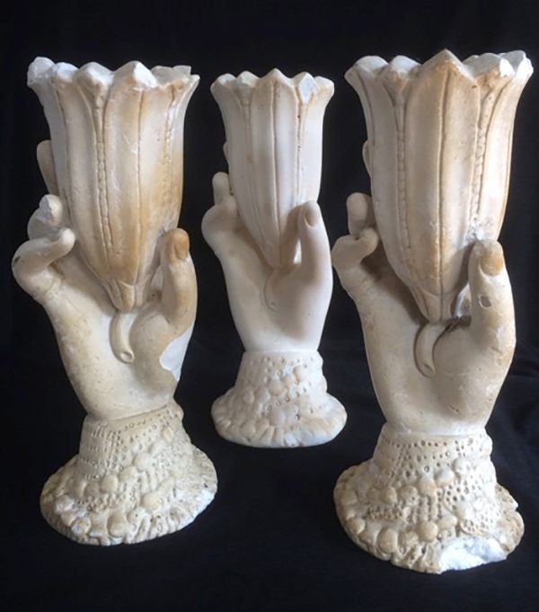 A trio of chalkware hands, maker and date unknown. Though the cheapest version in their day, chalkware hands are the rarest and most valuable today due to their extreme fragility.
