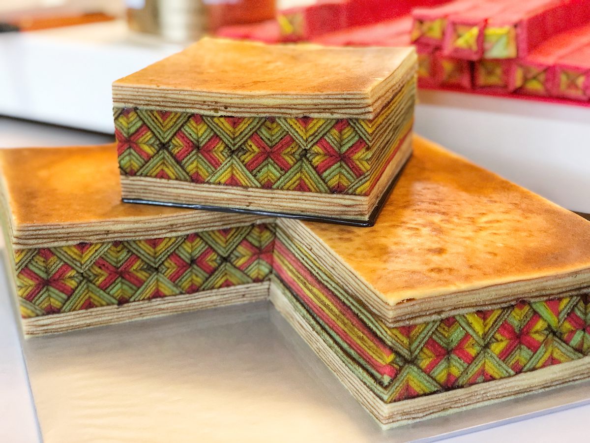 Slicing up the colorful cakes and gluing them together in vibrant patterns takes skill and patience.