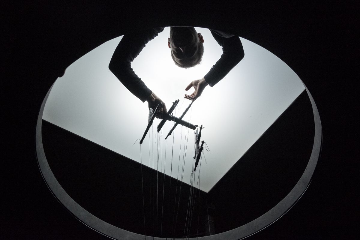 Adapted from “The Lost Ones” a short story by Samuel Beckett, "Milieu" tells the story of a trapped marionette. For the performance, puppeteer Renaud Herbin built a 12-foot cylindrical structure, and uses 7-foot strings to move his marionette.
