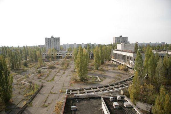 The center square of Pripyat, once home for 50,000 people. After 22 years of neglect, nature has started to seep through the concrete 