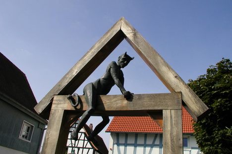 This Satanic figure watches over the city center.