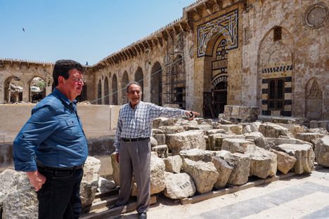 Architect Sakher Oulabi (left) and engineer Tamim Kasmo in the courtyard of Aleppo's Great Mosque.