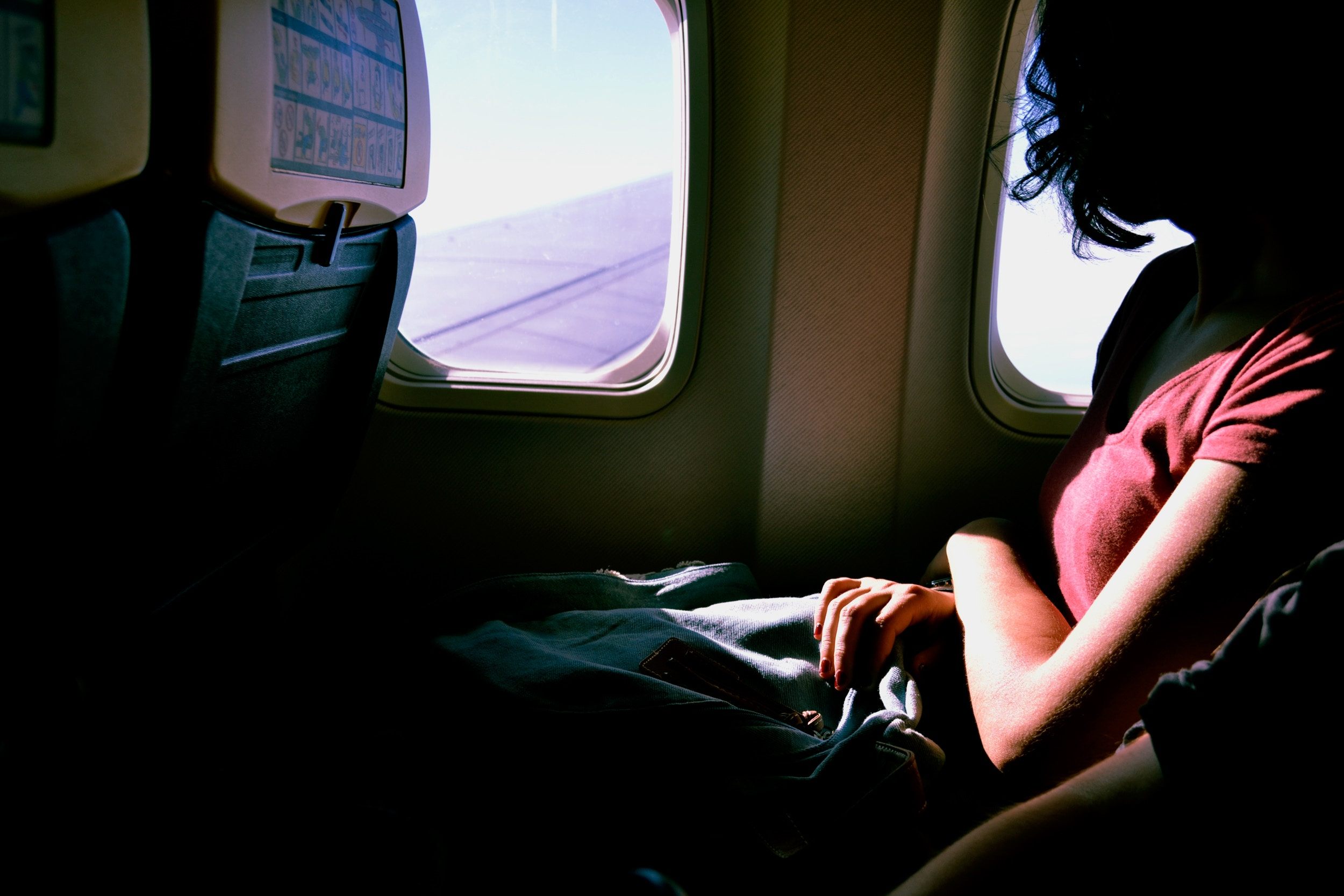 Gazing out the window on a metal bird.