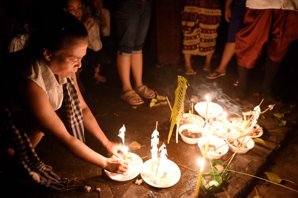 Offerings are given before dawn during Pchum Ben.