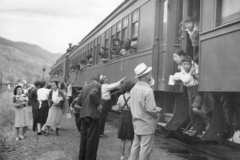Displaced&nbsp;Japanese Canadians leaving&nbsp;the&nbsp;Vancouver&nbsp;area (possibly Slocan Valley)&nbsp;after being prohibited by law&nbsp;from entering a “protected area” within 100 miles of the coast.&nbsp;The woman on the left in this Leonard Frank photograph holding the book is Nobuko Morimoto, the woman in dark cardigan is&nbsp;Tei&nbsp;Terashita, and the&nbsp;young&nbsp;woman leaning out of train is identified as&nbsp;Kazuyo&nbsp;Kawabata.