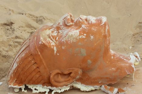The head of the plaster sphinx, following days of excavation. 