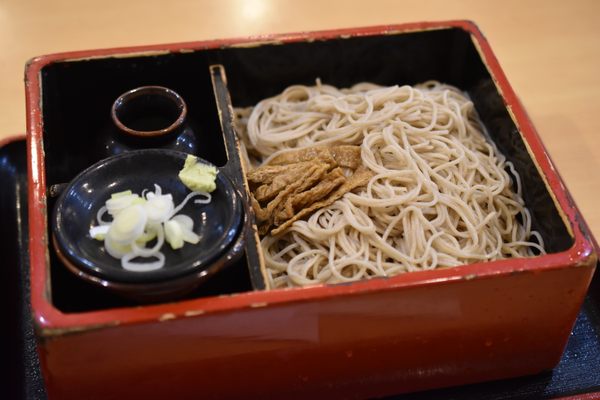 A simple box of soba noodles with aburaage (fried tofu), the foxes’ favorite food.