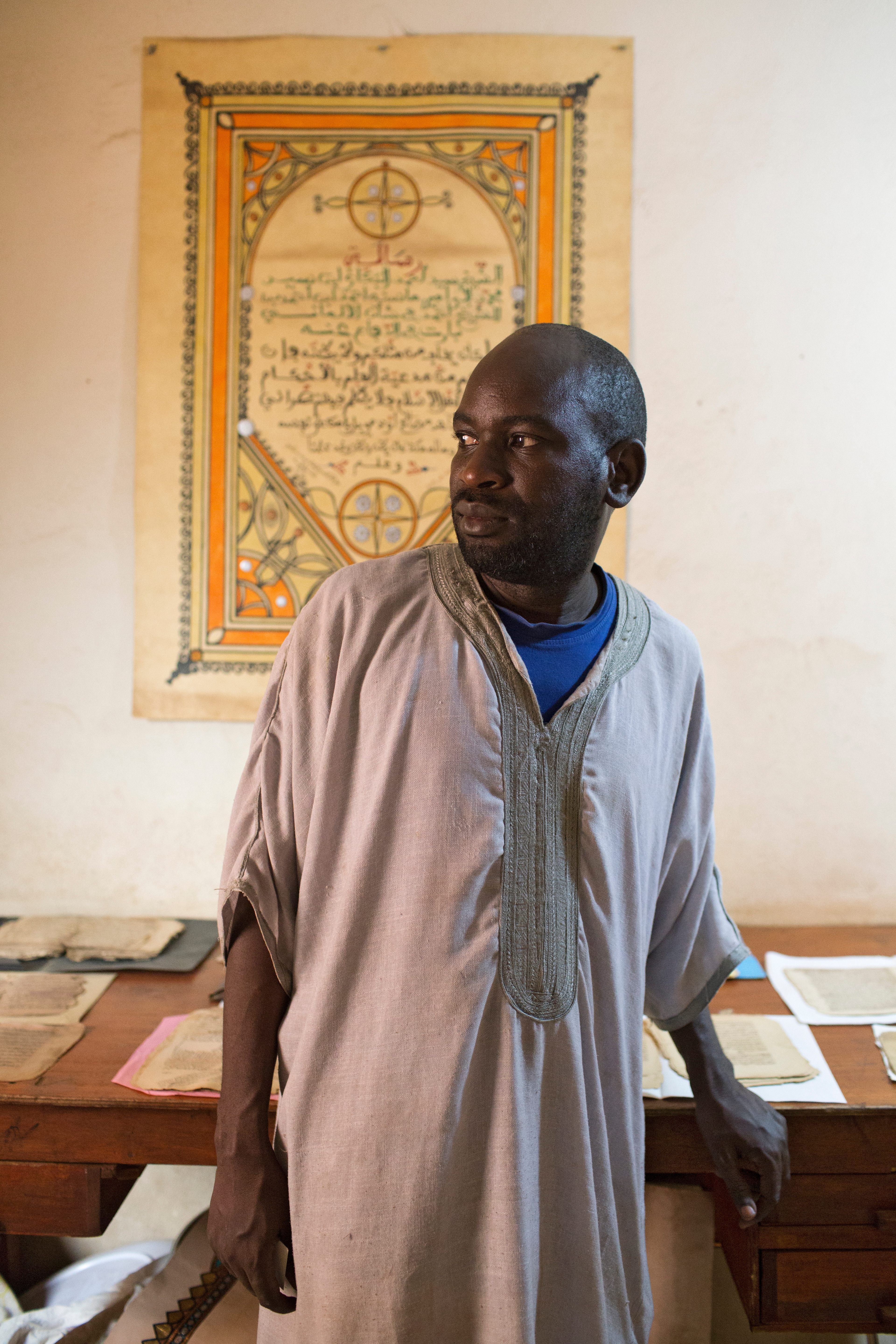 Master calligrapher Boubacar Sadek fled with his family to Bamako, Mali, during the Islamist takeover. Without tourists to attend his calligraphy workshops, he now creates personalized cards for Postcards from Timbuktu.