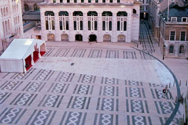 A circular outline marks the underground location of the Roman amphitheater