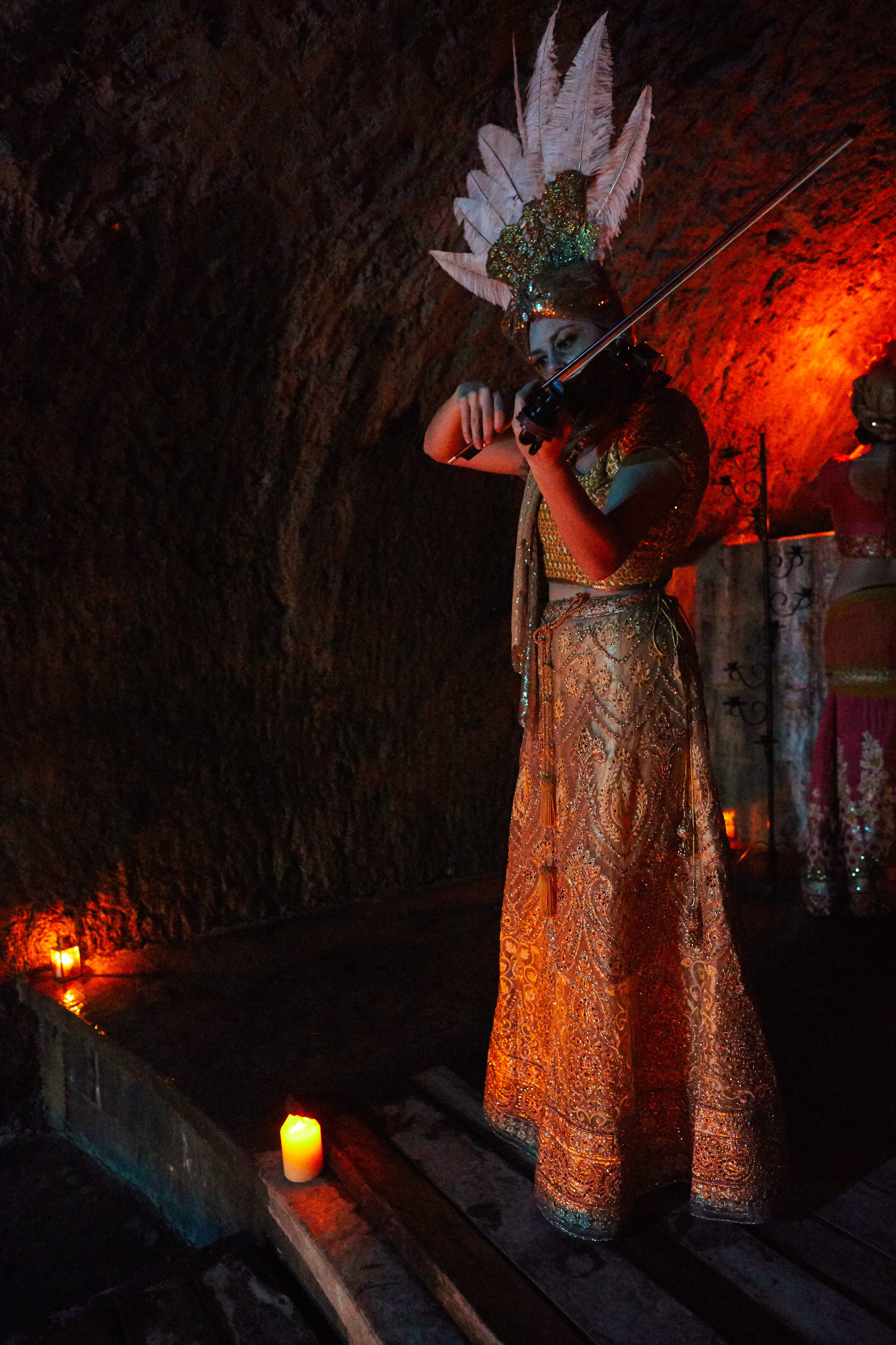 Violinist Adriana Molello plays in one of Albion Castle's subterranean waterways. 