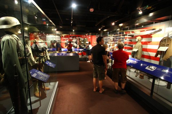 The National WWII Museum in New Orleans houses uniforms, equipment, and more than two dozen signed and captured Nazi flags.