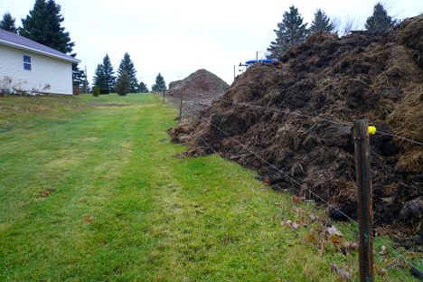 Couple Accused of Using a Massive Manure Pile to Annoy Their Neighbors
