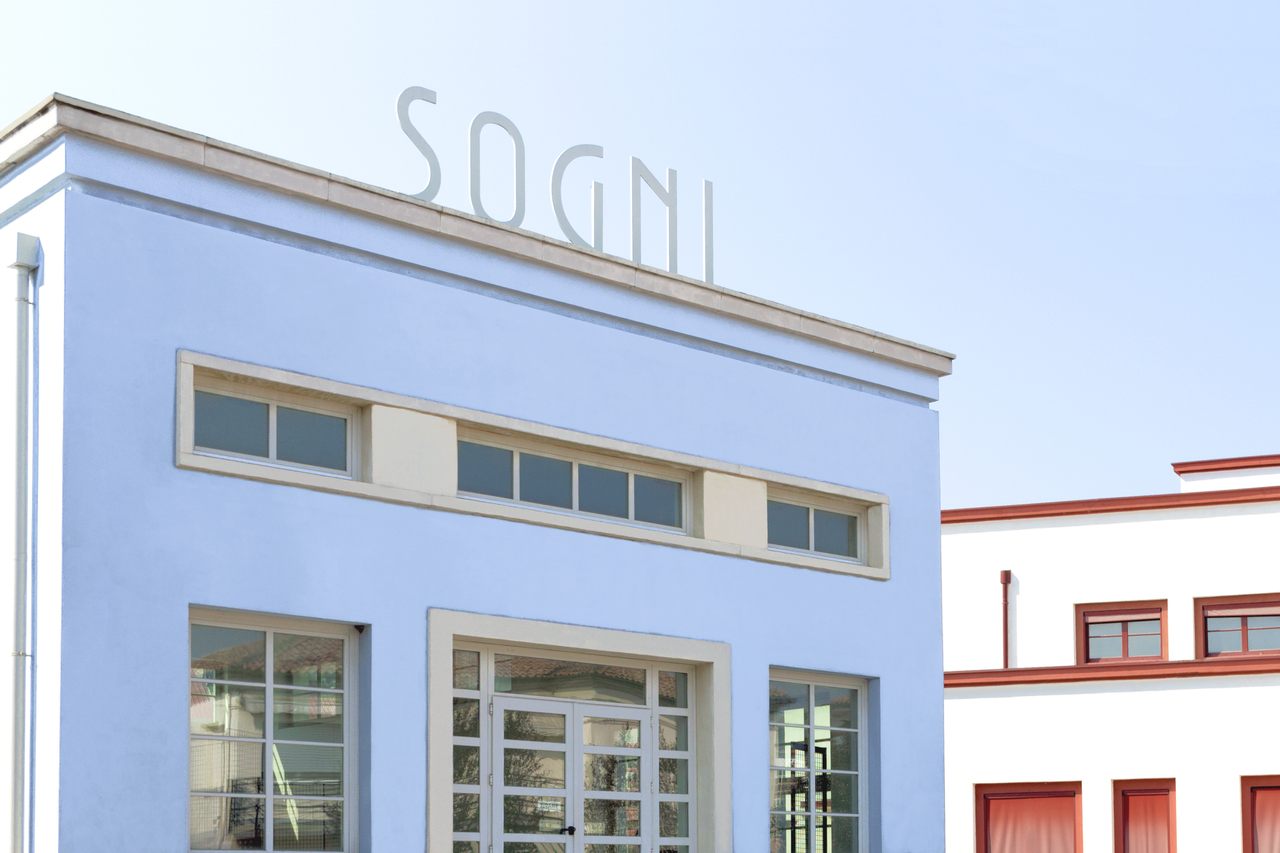 The city's former bathhouse, topped with the word "sogni" ("dreams"), has become Tresigallo's most iconic building, a favorite photo spot for artists and tourists breathing new life into the forgotten city.
