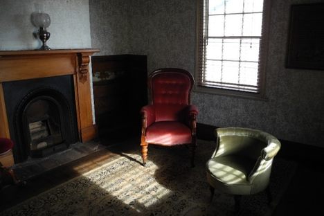 The parlor looks as though someone might come home at any minute. 