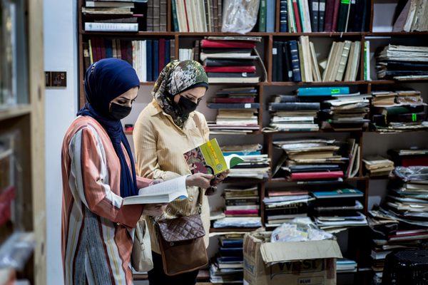 Customers return to Maktaba al-Sham in Mosul's Old City. Shopping for books on Najafi Street is a tradition that dates back more than a century.