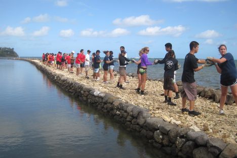 Volunteers restoring the pond's wall.  