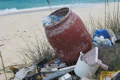 Trash accumulates on a Bahamas beach overlooking the Atlantic.