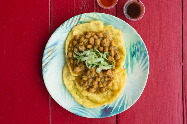 The doubles here consist of perfectly fried flatbreads cradling tender chickpeas.