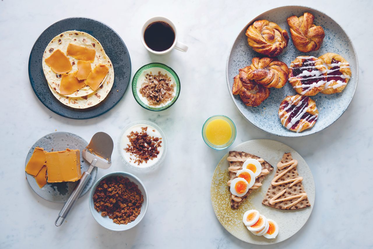 A Nordic breakfast spread, including a brown cheese, or <em>brunost</em>, on flatbread.