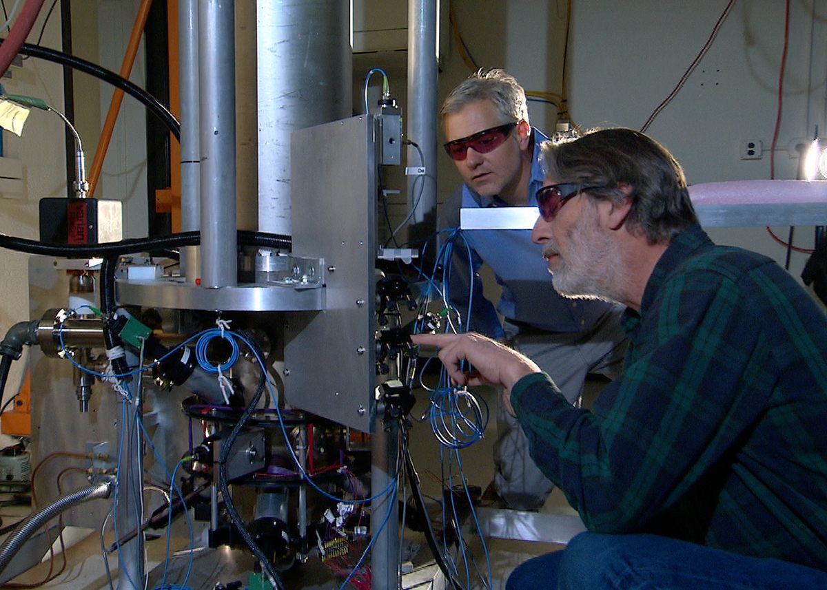 NIST physicists Steve Jefferts (foreground) and Tom Heavner with the NIST-F2 cesium fountain atomic clock