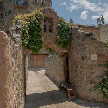 An archway in Val'Quirico, its look was inspired by Tuscan architecture and the hacienda's original buildings .