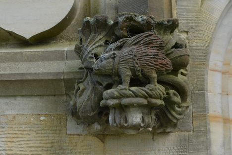 Stone carving at the entrance to the Sidney Chapel featuring the porcupine family crest of the Sidneys