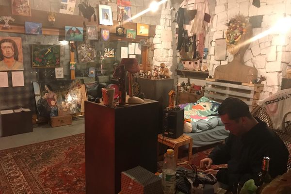 The room is packed with outsider art.
