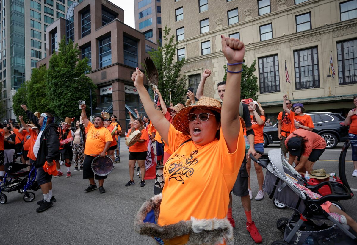 Members of the indigenous community participate in a rally in Vancouver on July 1, 2021.