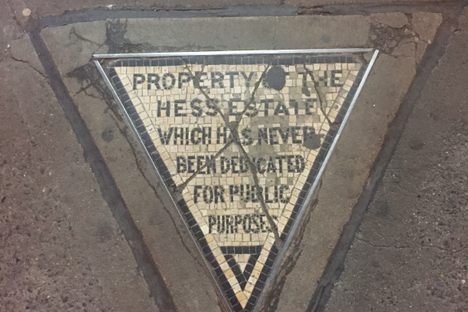 Stand on the tiniest, angriest piece of private property in the city.