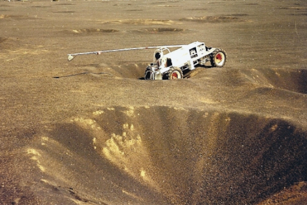 A rover stuck in a crater.