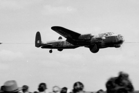 A plane from the movie "The Dambusters," based on the true story of Operation Chastise, flies over Coventry Airport.