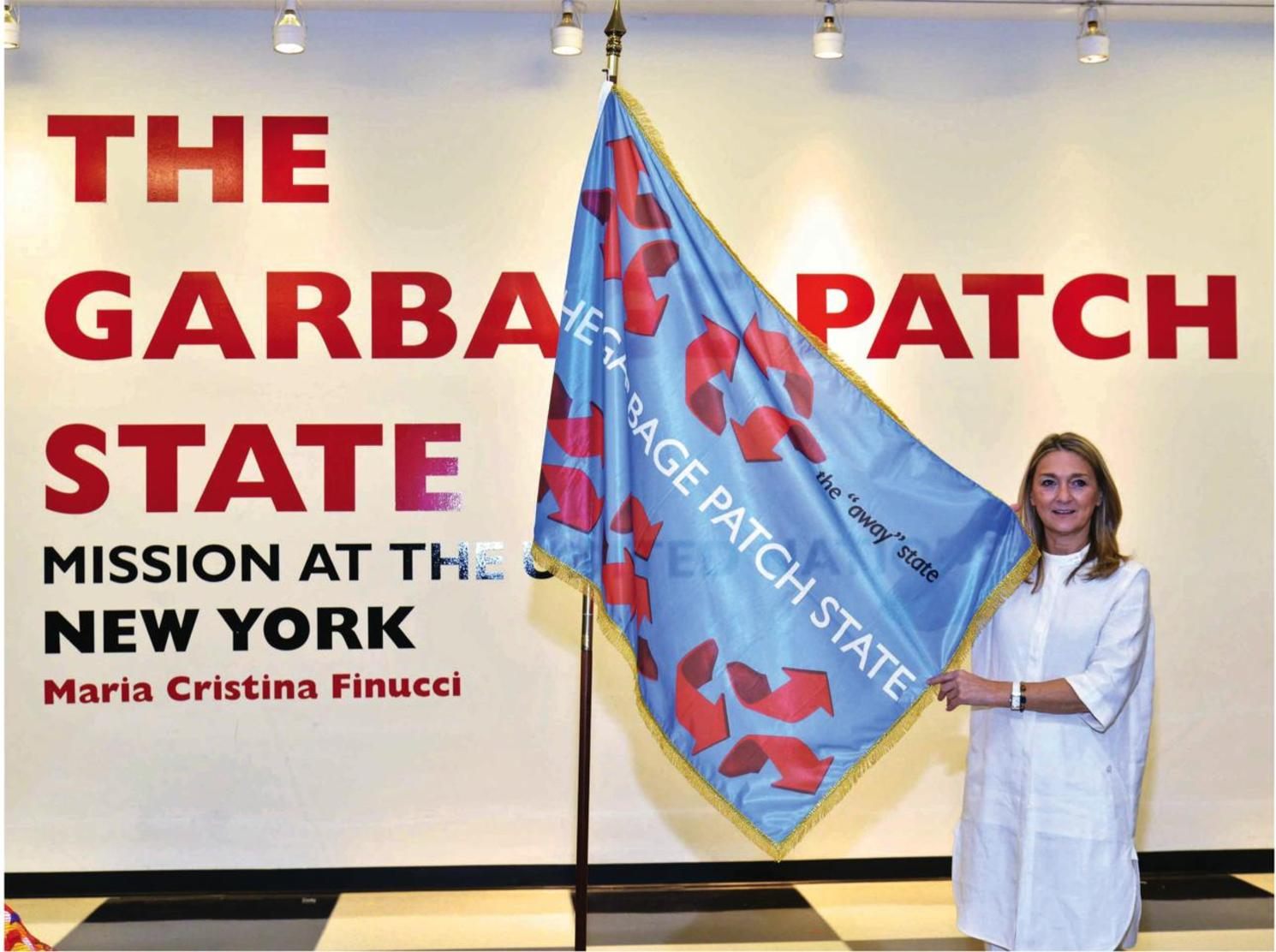 Finucci holding the flag of the Garbage Patch State during a visit to the United Nations headquarters. 