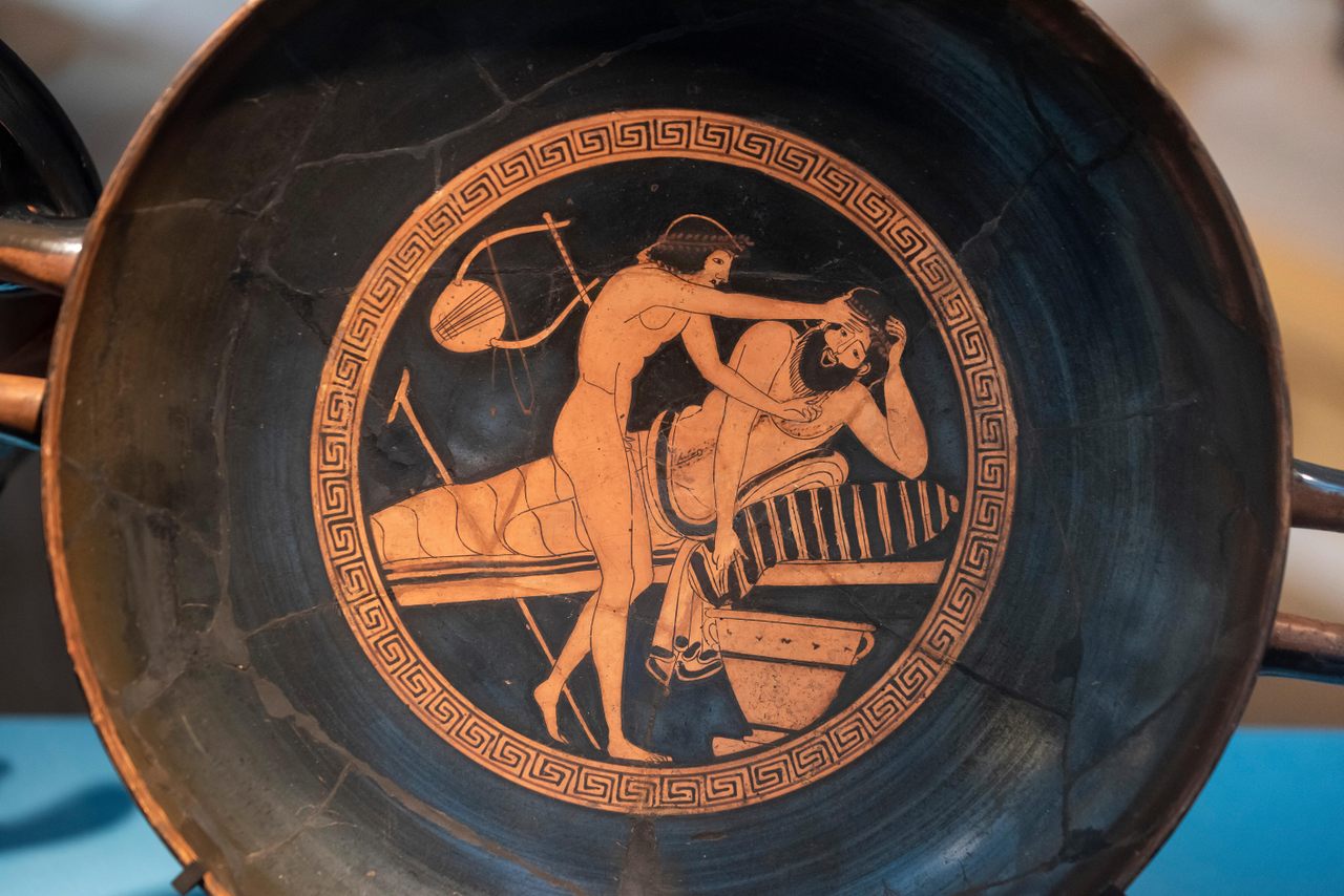 The Ancient Greeks often decorated pottery used during parties with scenes from those events, like this <em>symposium</em> (drinking party) attendee getting sick from too much wine.