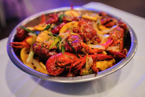 The “Kitchen Special” Viet-Cajun-style crawfish come with citrus slices. 