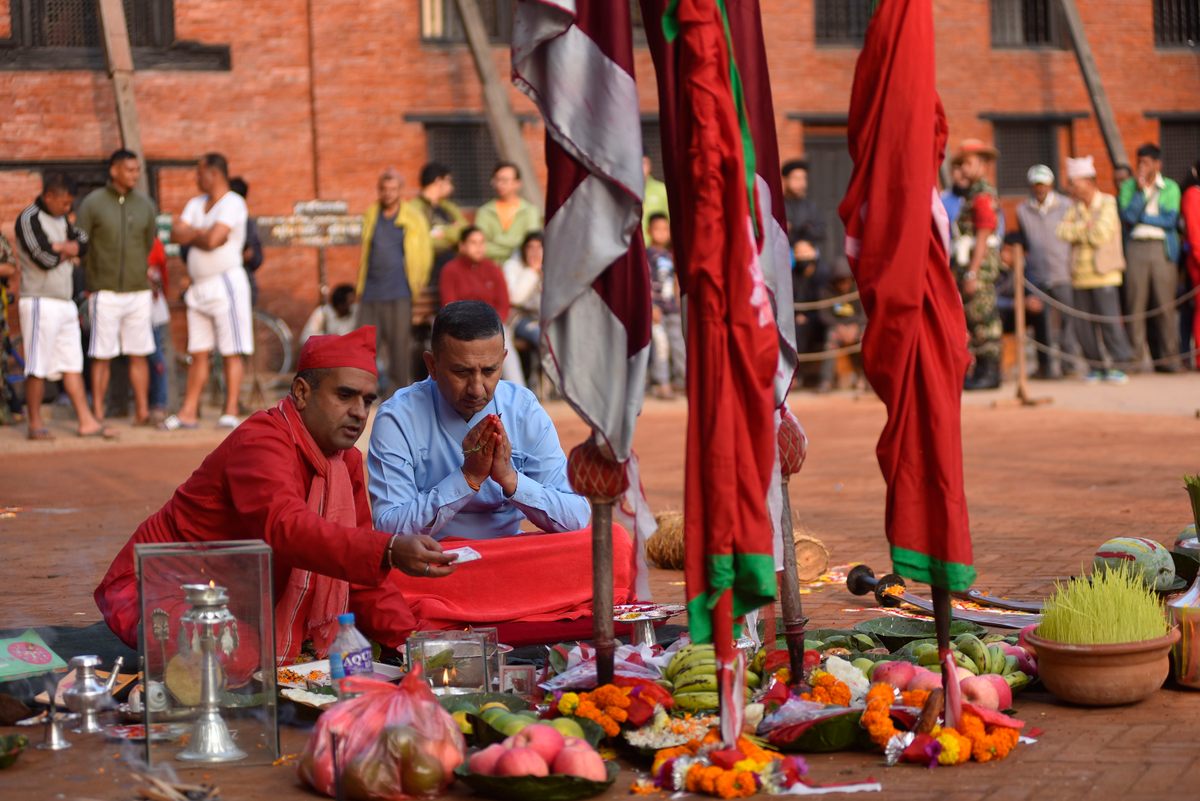 A Nepalese priest offering ritual <em>puja</em> before performing animal sacrifice on the ninth day of Dashain.