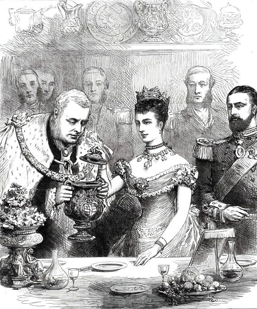 In this 1876 print, the future King Edward VII and Queen Alexandra sample a loving cup at a guildhall banquet. 