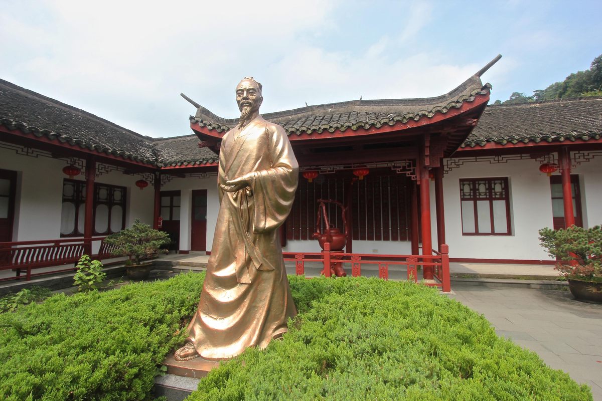 A gold statue of Lu Yu at Longjing tea plantation Hangzhou China.