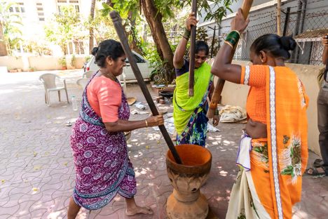Making the spices is often a symphony of jangling bangles and rhythmic pounding.