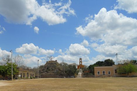 Overview of the hacienda; abandoned building at left, pyramid, chapel built atop another pyramid, casa principal at right. Not pictured and further right is the casa de maquinas and the ruins