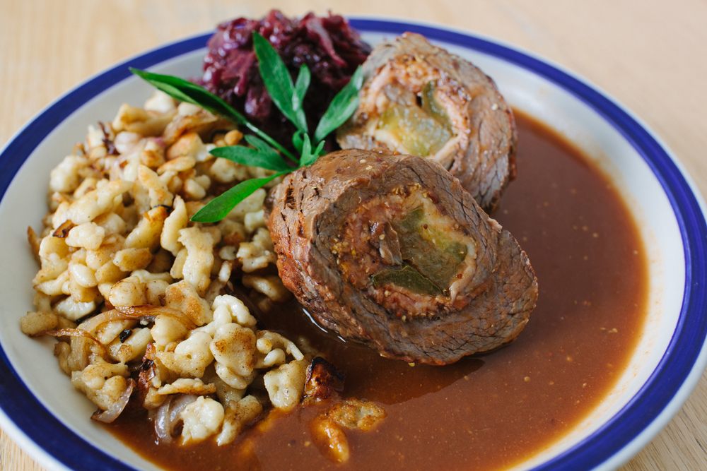 The impossibly rich <em>rinderrouladen</em> features tri-tip stuffed with pickles, bacon, and mustard.