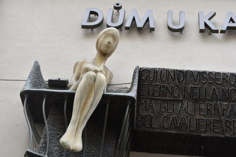 The 'stone maiden' watches over the street.