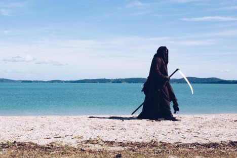 The Swim Reaper, out doing his own special kind of beachcombing.