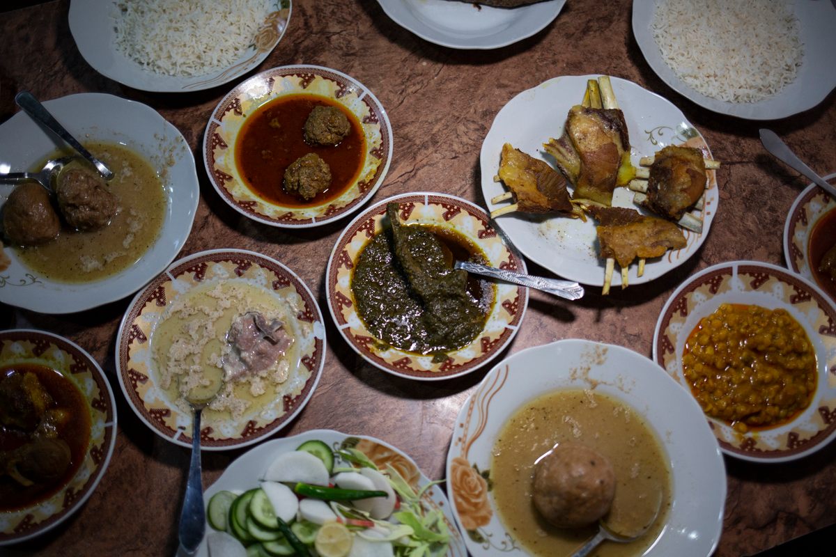 A Kashmiri wazwan at Dilbar, including kofta curry, seekh kebab, tabaq maz, goshtaba, salad, and aab gosht, and palak spinach.