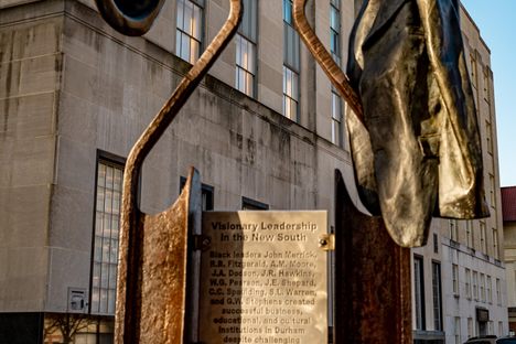 Six bronze sculptures now line Parrish Street, “tracing and interpreting its historic significance via three themes: Tobacco and E.J. Parrish (1865-1890), Visionary Leadership in the New South (1890-1915), and A Black Capital for the World to See (1915-1945).”