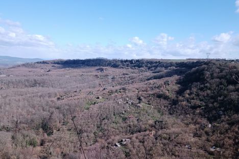 The view over the valley below where all of the volcanic boulders are visible