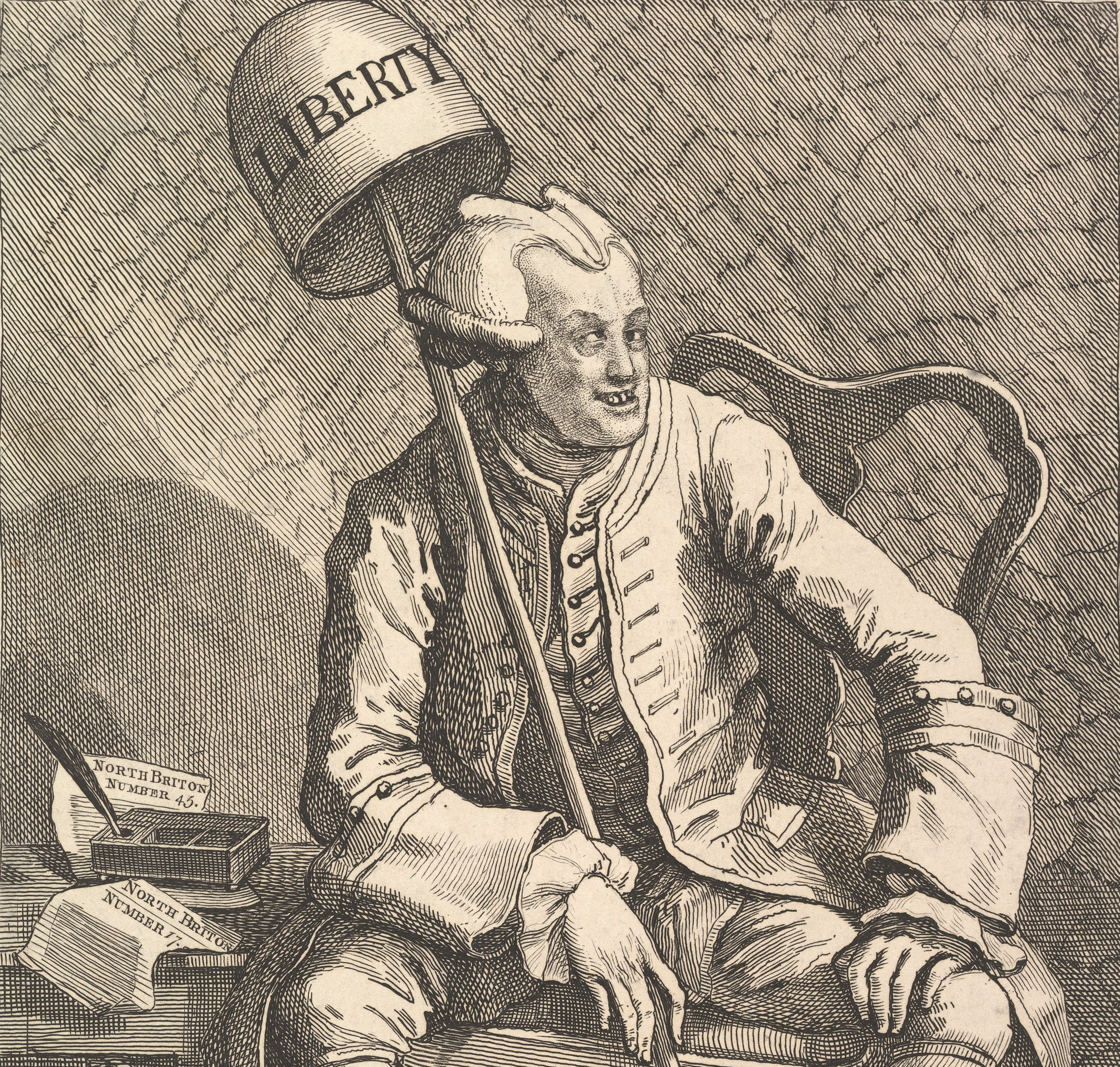 The notorious John Wilkes, with <em>The North Briton</em> issue number 45 by his side, captured in an engraving by noted satirist William Hogarth.