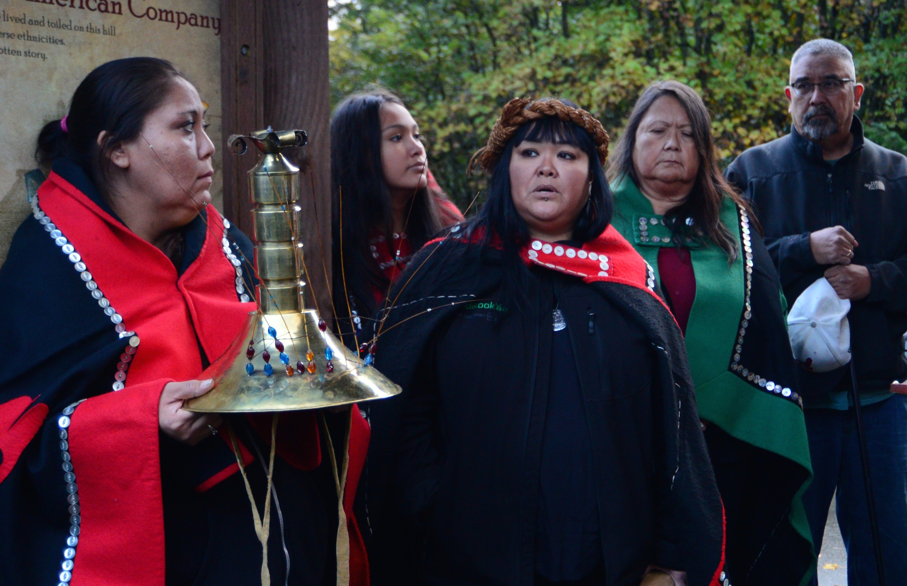 On October 15, Dionne Brady-Howard (center) and her mother Louise Brady (in green) gather with other members of the Tlingit tribe at the base of Noow Tlein, a former Kiks.ádi clan settlement.