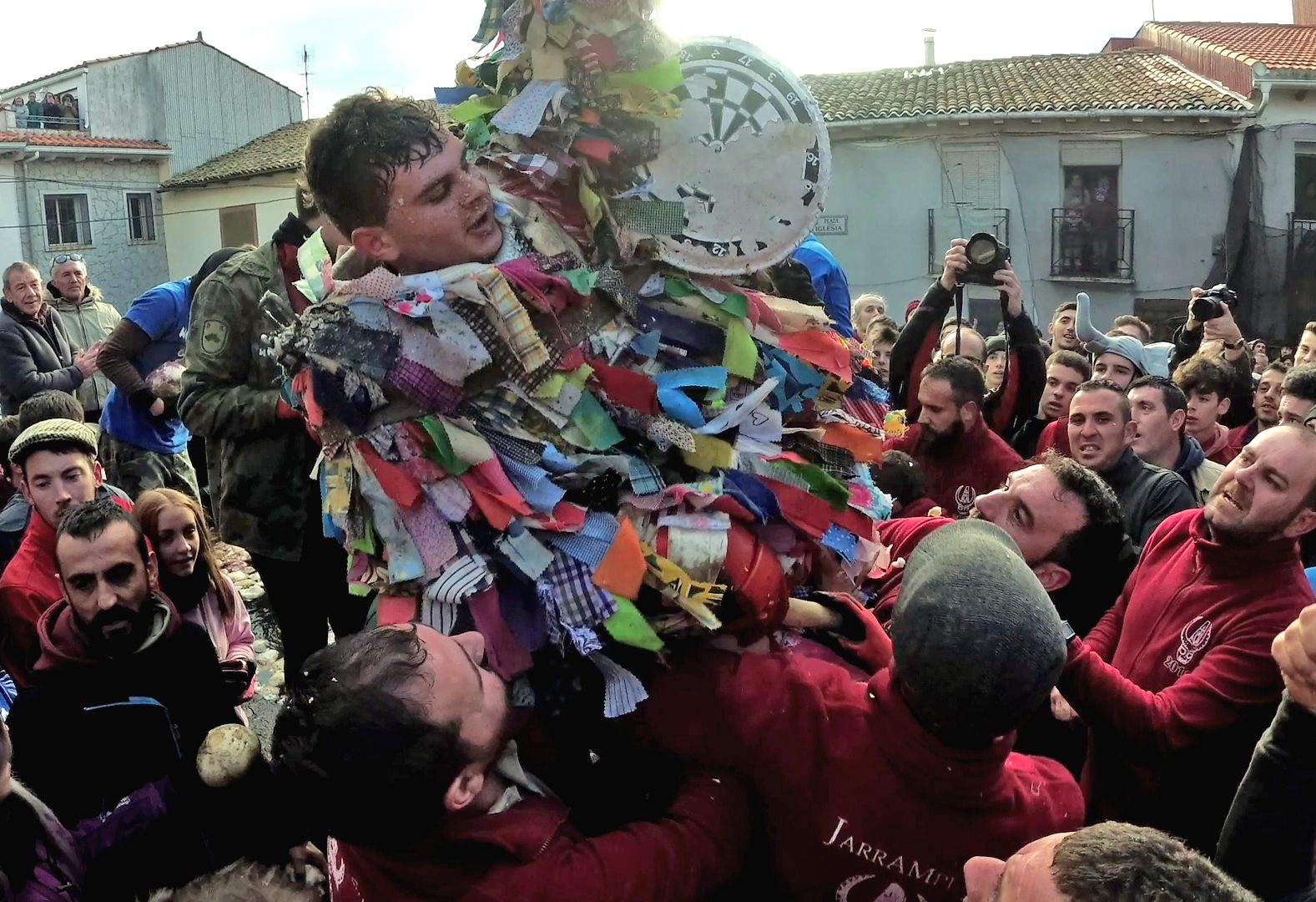 After surviving an hour, Adrián Moreno Serrano is lifted into the air in celebration.