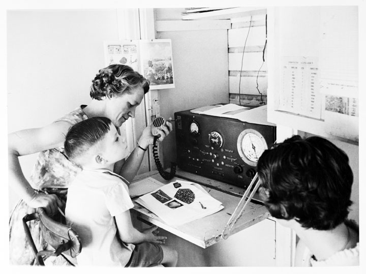A School of the Air primary student in regional Queensland takes class via two way radio, c. 1960