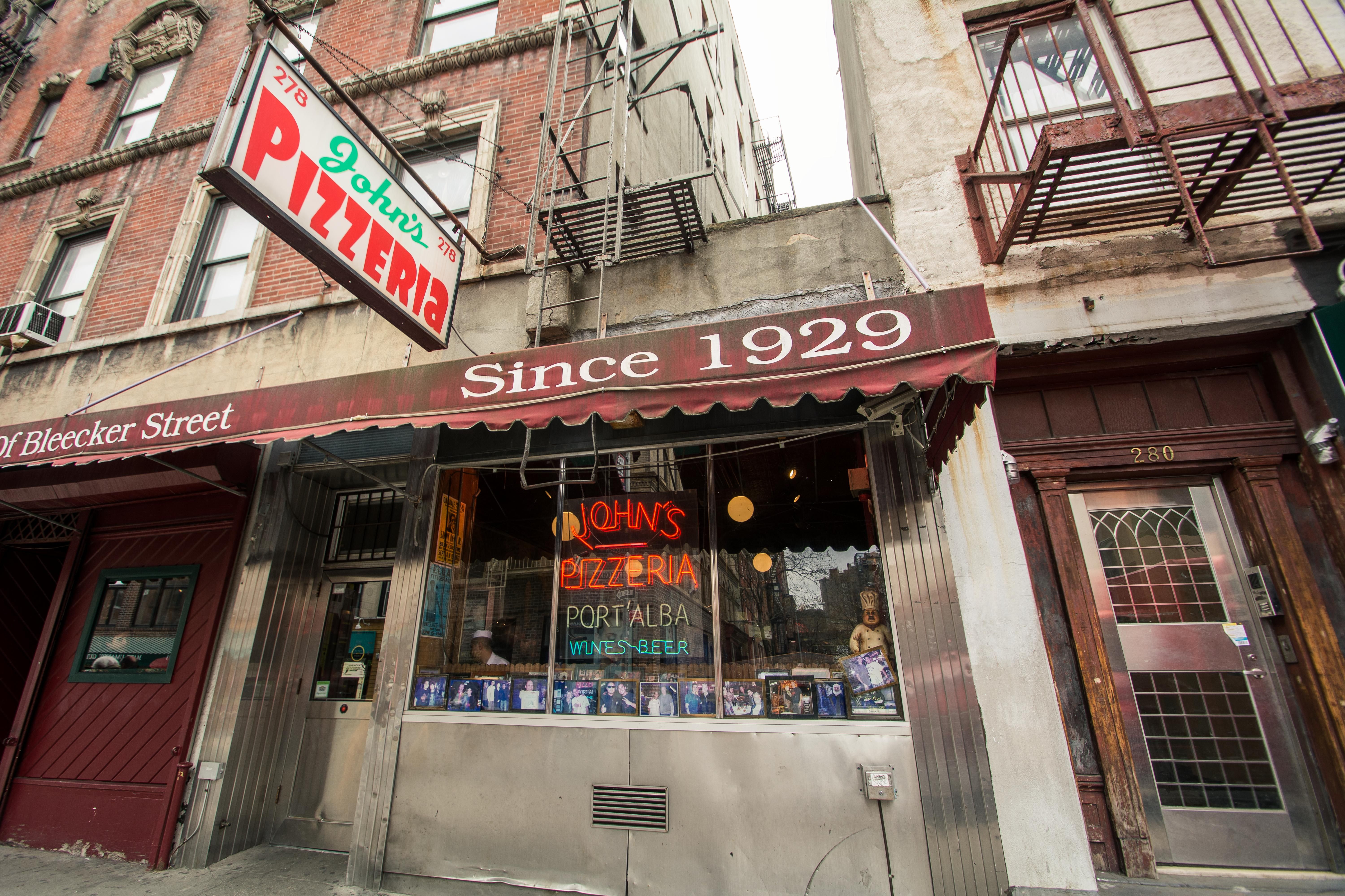 John's Pizzeria in New York City. They advertise "no slices" on the other side of their awning.